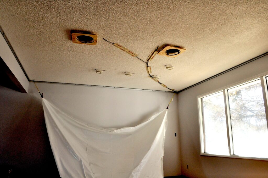 A dusty popcorn ceiling showing a textured surface.